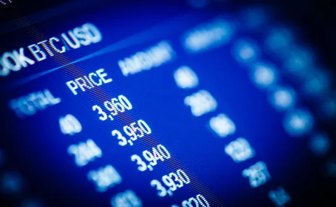 Blue trading screen showing BTC/USD amounts